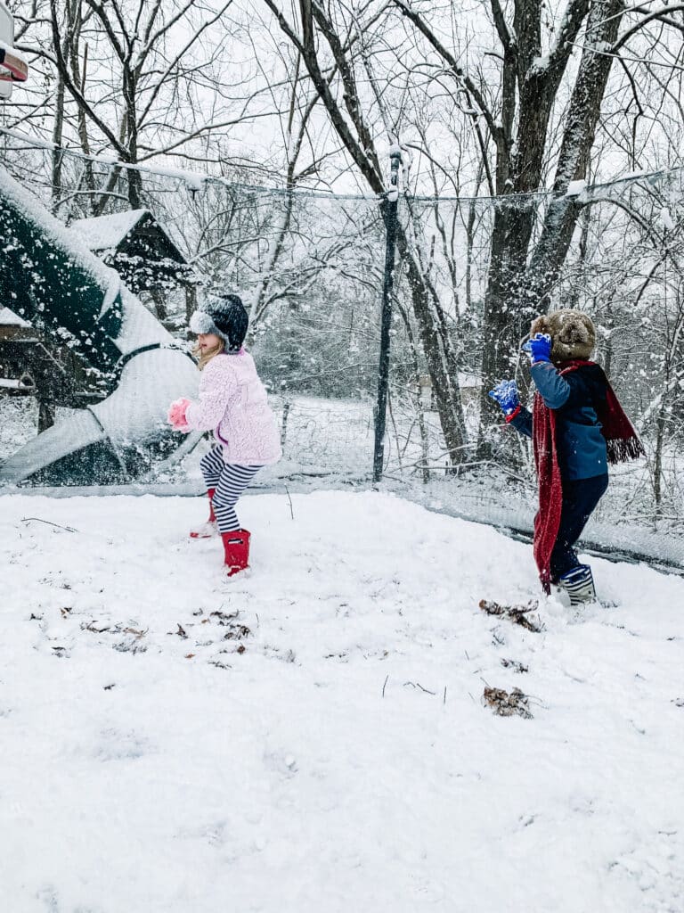 Playing in the snow on the trampoline